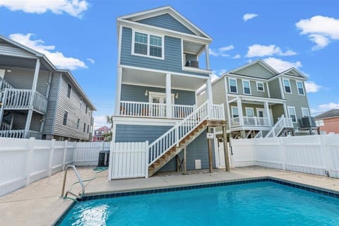 Charming beach house with private pool and elevated deck creates the perfect coastal retreat for your getaway.