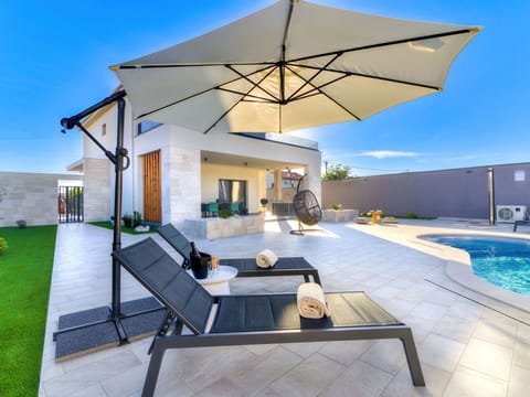 Water, Sky, Property, Plant, Azure, Swimming Pool, Tree, Leisure, Shade, Building