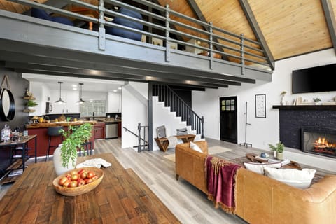 The lofted space overlooks the living room.
