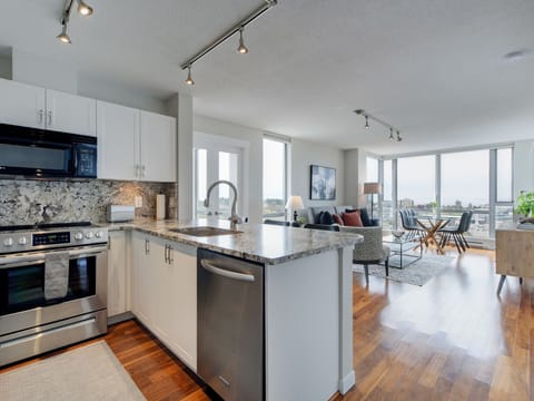 Gourmet Kitchen with Open Concept Living and Dining Area