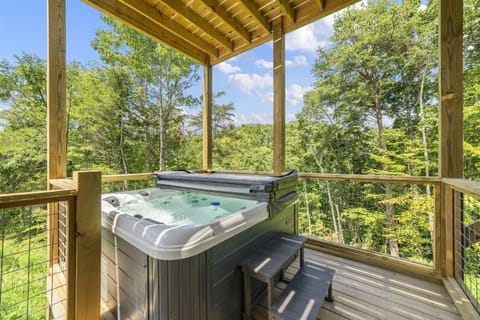 Soak in our hot tub while enjoying stunning views of the surrounding landscape.