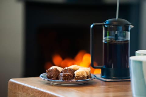 Coffee by the cosy wood burning stove
