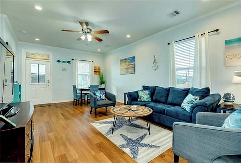 Sit back and relax after a day at the beach in the living room.