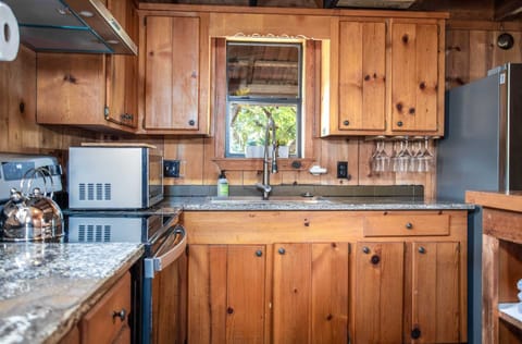 Rustic woodwork gives the farmhouse kitchen a warm and authentic western look.