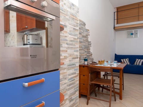 Furniture, Flooring, Wood, Interior Design, Floor, Kitchen, Room, Countertop, Home, Cabinetry