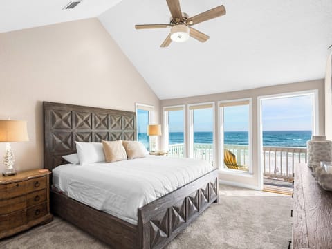 Bedroom 1 - Wake to endless Gulf views from your comfortable bed, where gentle sea breezes flow through open doors to your private beach balcony.