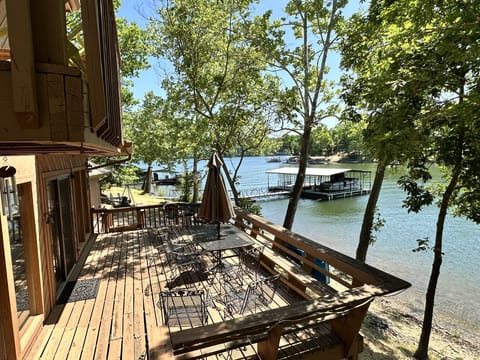 Large Deck off kitchen/Great rm. Go swimming, to dock, firepit, grill or ramp.