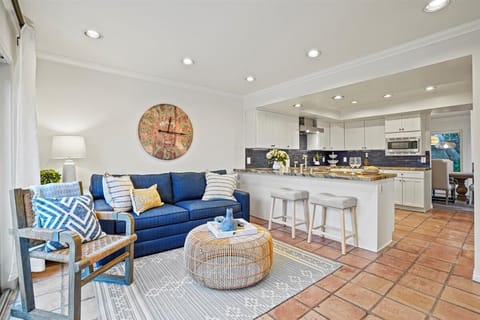 Family Room off kitchen opens to pool deck. Fold out airbed in sofa.