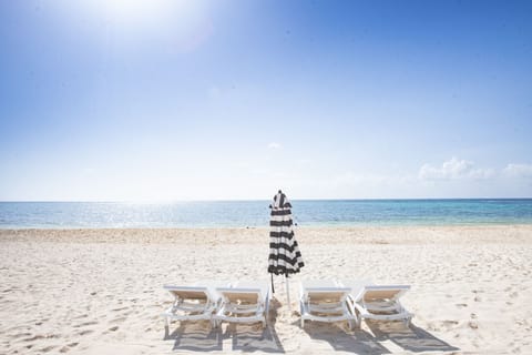 Soft sand, private loungers, and the stunning ocean laid out before you. 