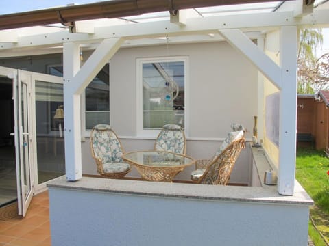 Couch, Furniture, Plant, Building, Table, Wood, House, Chair, Shade, Interior Design