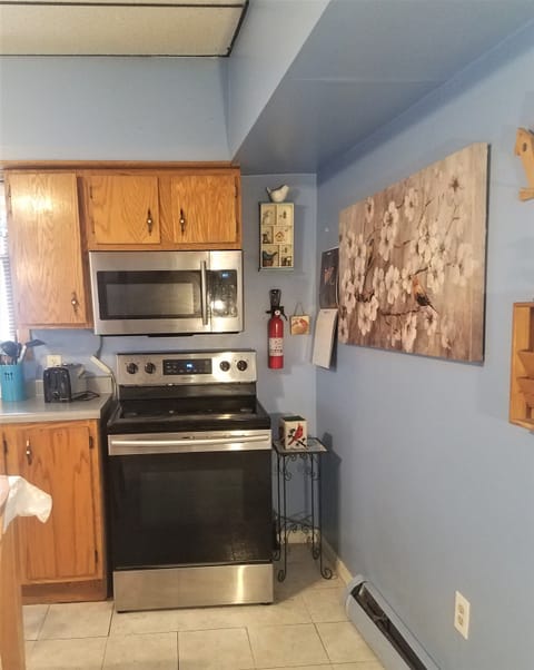 Kitchen has lots of cupboard/counter space and large eat in table