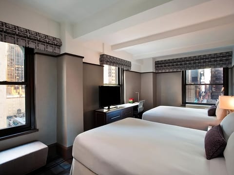 Enjoy morning light and extra space around two comfortable beds.