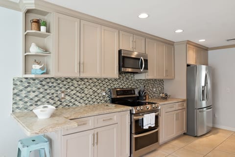2nd floor kitchen off the dinning area. Featuring two separate ovens, and microwave oven.