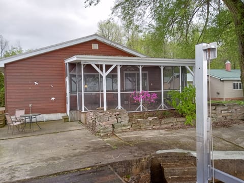very large screened in porch, patio right on the river
