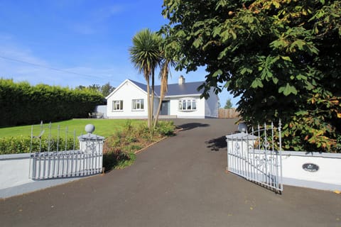 View of house from road; gates provided for child safety.