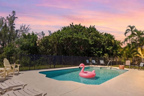 Private tropical pool deck with sunset views and relaxing lounge seating