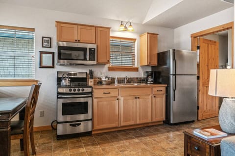 Cook up a meal in this cute kitchen.