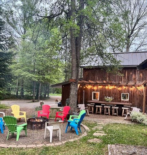 Outdoor patio with firepit and charcoal grill
