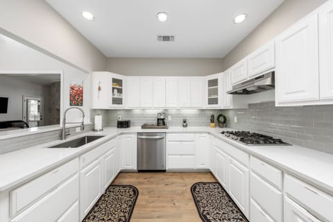 Fully stocked kitchen with gas burning stove