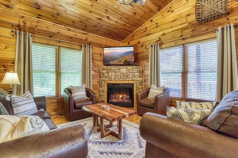 Comfy leather living room swivel chairs with sleeper sofa and loveseat.