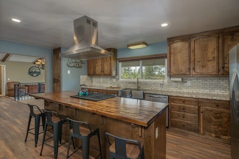 Butcher block island with seating for 4.