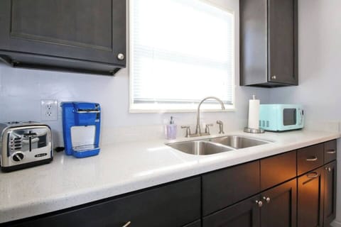 Microwave, toaster, and Keurig coffee maker complete with a supply of K-cups.