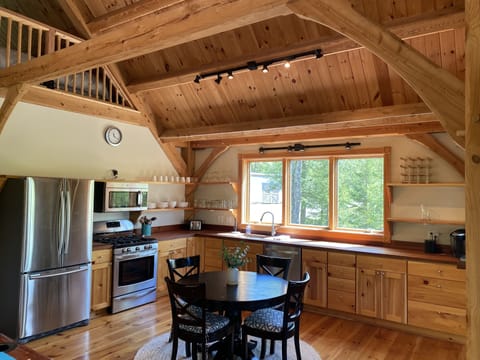 Fully equipped kitchen with stainless steel appliances.