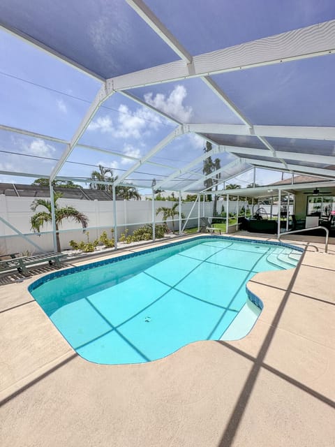 Heated swimming pool with sun loungers