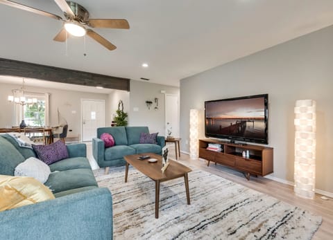 Living room with 65" TV with Roku device and included wifi
