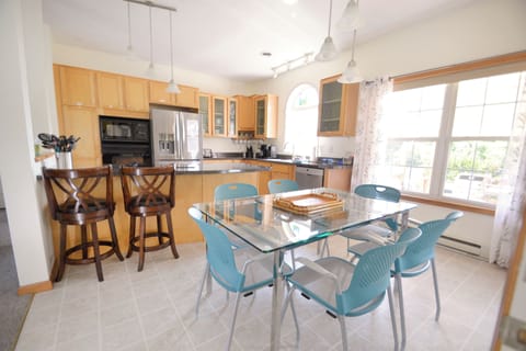 Dining Area with a view to the deck and fenced in yard