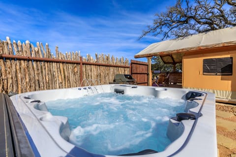 private yard with hot tub & propane grill