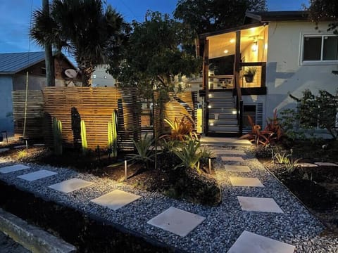 Beautiful Night View: Landscaping and entrance to the second floor apartment
