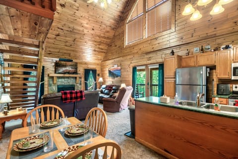 The kitchen and living room with the cathedral ceiling give that cabin feel!