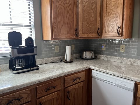 Toaster, brewing pot and Kuerig for your coffee.