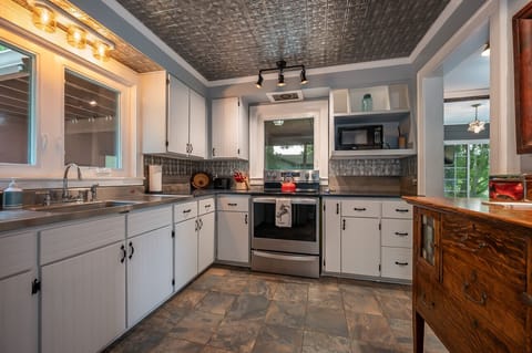 Kitchen is equipped with an electric smooth top range