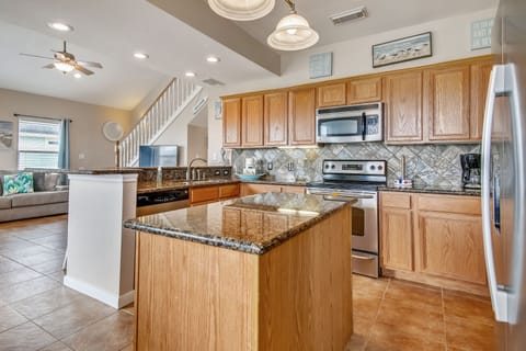 Kitchen Island - Our spacious kitchen island works perfectly as a breakfast bar or extra counter space when preparing a family meal or divvying up takeout!