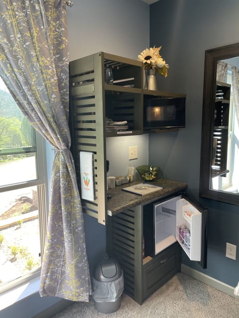 Kitchenette offers a mini-fridge, microwave, coffee maker & dinnerware for two.