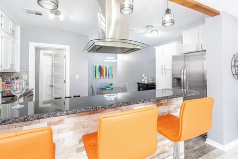 Fun orange bar stools available for guests to enjoy breakfast or drinks 