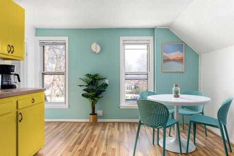 Charming kitchen nook with seating for four, featuring a bright, flavorful retro-vintage vibe.