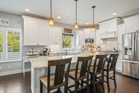 7. Ultra-modern kitchen with a large island and a breakfast bar for four.