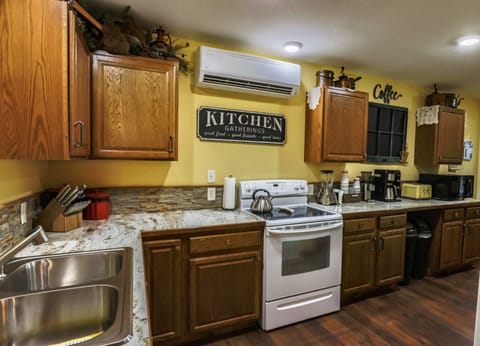 The SPLITTER over the stove, provides the A/C.  Ceiling fans help circulate air.