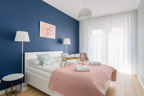 Modern bedroom with a comfortable double bed.