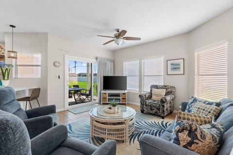 Relax in your bright living room with comfortable seating and sliding doors opening to your private patio.