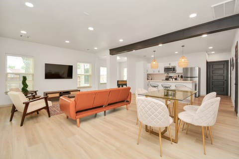 Open floor plan between the kitchen, living and dining spaces.