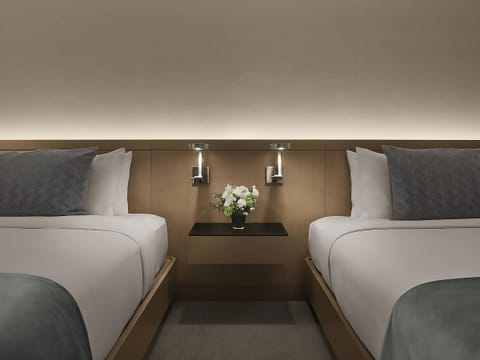 Drift off with soothing bedside lighting and hotel-soft pillows.