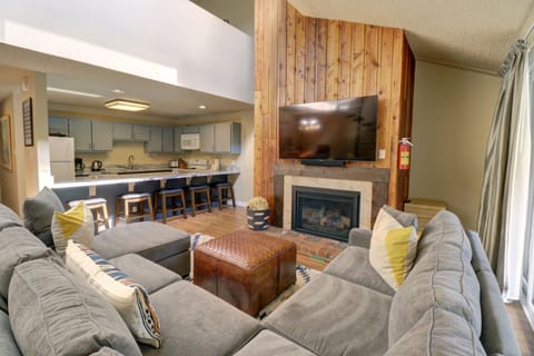 Cozy living room looking over to kitchen.