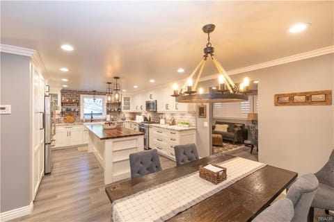 Dining area open to the game room and kitchen