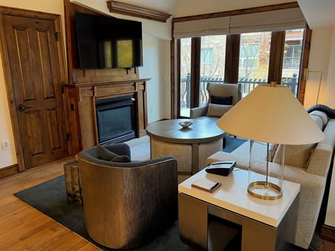 Sitting room with fireplace and large screen TV