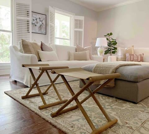 With two large couches, an ottoman, and additional fold out benches, there is more than enough seating in this spacious living room. Relax and watch your favorite shows on the 55” smart TV.
