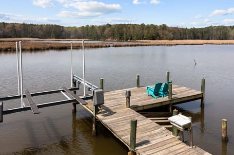 Waterfront with large dock with kayak ramp.